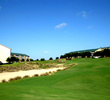 On the par-5 eighth hole at Mystic Dunes Golf Club, the fairway rises dramatically from the tee box, blocking out the pin, then drops down to a green that is partially hidden on the approach shot.