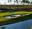 Aim down the left side of the fairway on your tee shot.  An accurate layup is needed to avoid well placed fairway bunkers.  The green slopes tremendously from back to front.  Long is no option where a water hazard lurks.