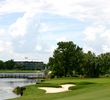 The par-4 sixth hole at Grande Pines Golf Club is a dogleg left around water. 