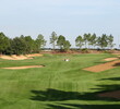 The sand flies at you from the first hole at Southern Dunes Golf & Country Club outside Orlando.
