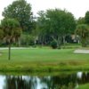 A view of green flanked by bunkers at Lake Orlando Golf Club