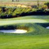 A view of a green protected by bunkers at Stoneybrook West Golf Course