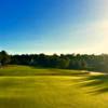 A sunny day view of a green at Kings Ridge Golf Club