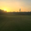 A sunset view of a hole at Kings Ridge Golf Club