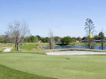 A view of green with water in background at Lakes at Leesburg (Hometown America)