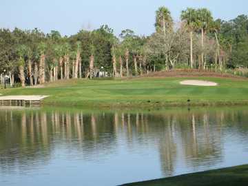 A view over the water of a hole at Alaqua Country Club